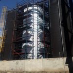 Vertical insulated pencil tank at a blending plant in an oil refinery